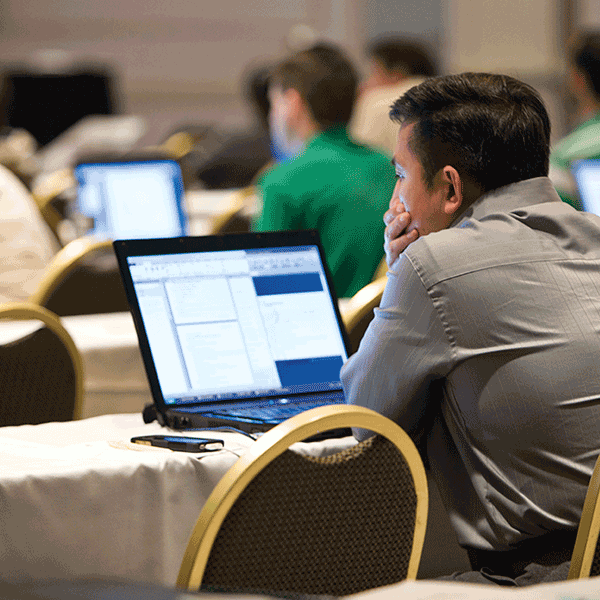 Family medicine physician studying with QBank materials and exam blueprint guide to prepare for the ABFM certification exam